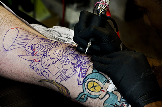 Getting a Tattoo in Miami Working on Art Work small Welcoming Eternal Truth Tattoo