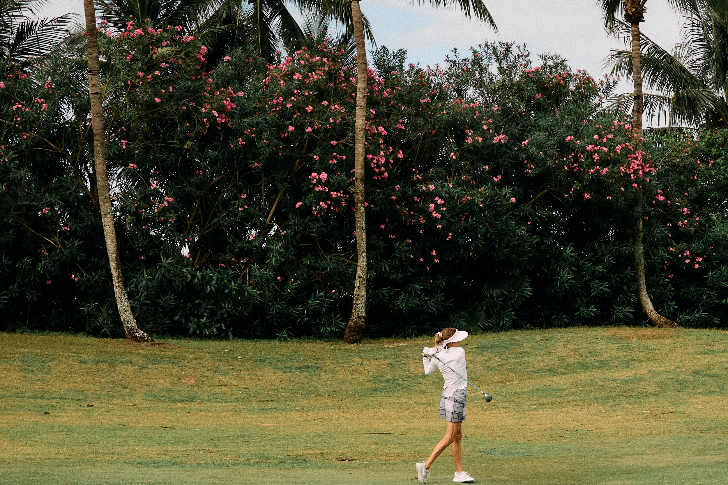 shot of fairway flowers from a golf hitting fairway woods on golf lifestyle session using Nikon Zfc