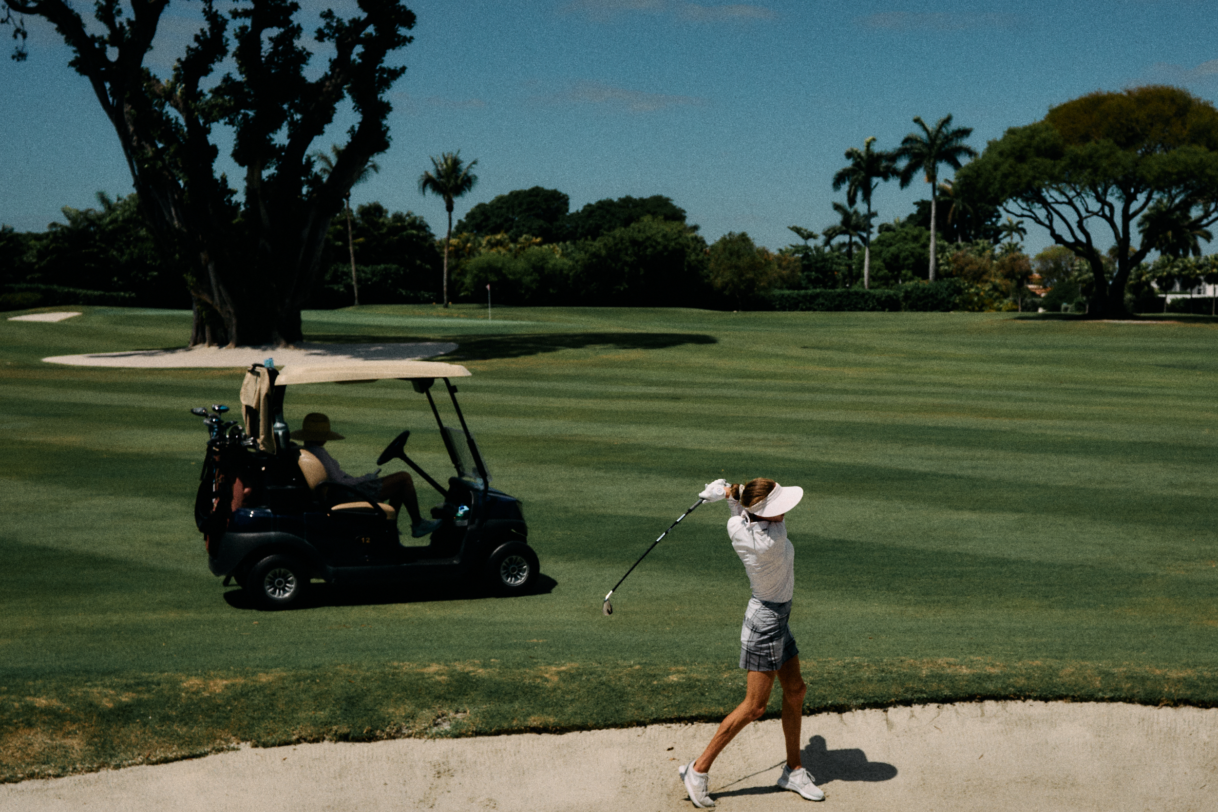 golfer hitting out of a bunker captured with Nikon Zfc
