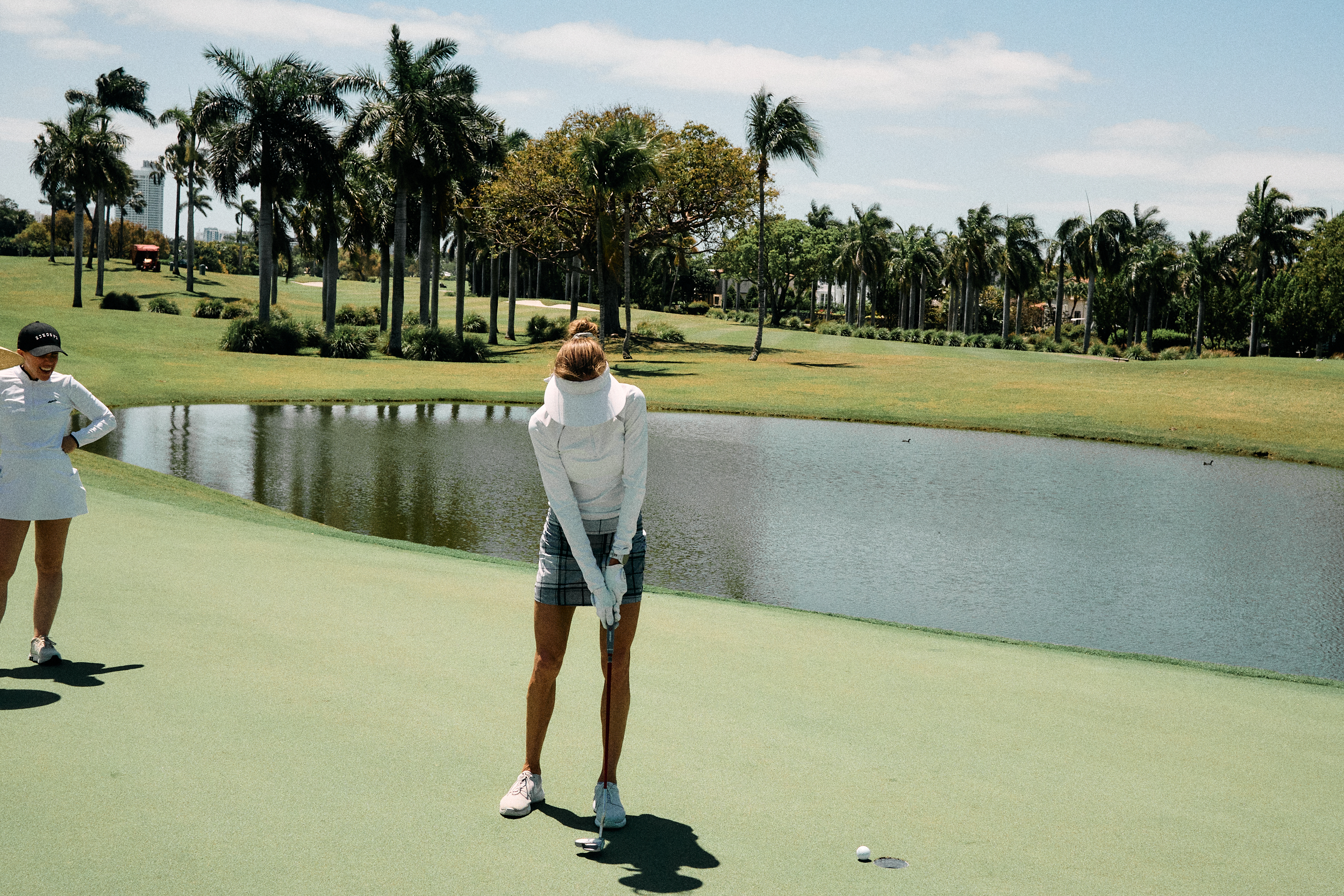 golfer making up a putt on the green during a lifestyle shoot.