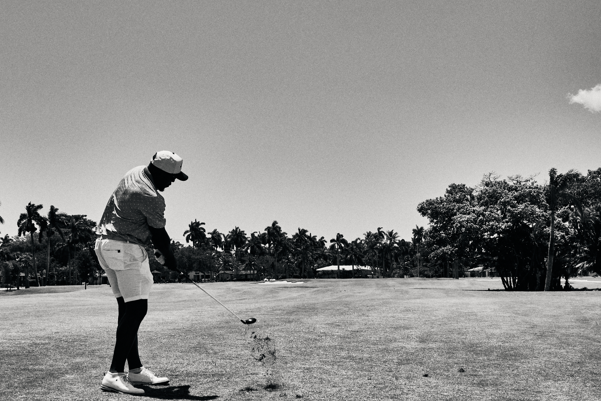 Dwayne Tucker hitting a three hybrid toward the green at Hollywood Beach Golf Club.